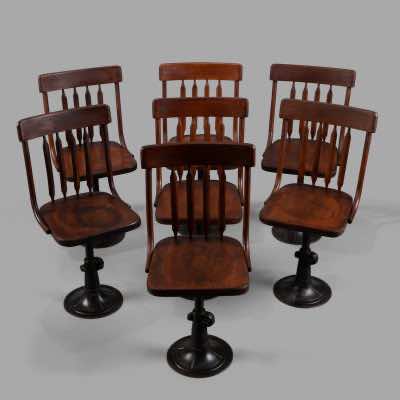 Série de 7 chaises de bureau à hauteur ajustable, c. 1895